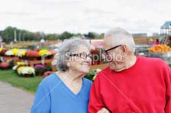 elderly couple enjoying a fair
