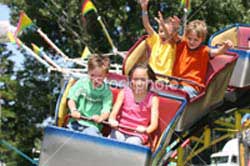 kids riding a roller coaster